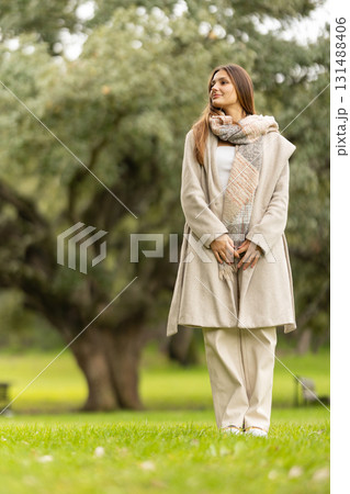 Young woman enjoying a peaceful day in park 131488406
