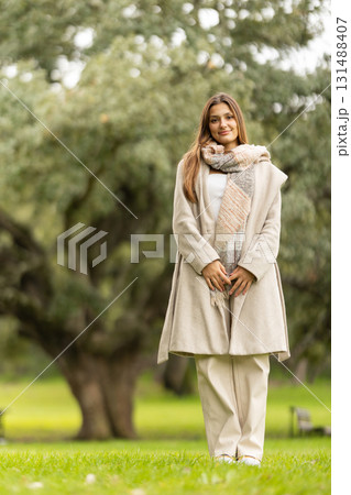 Young woman enjoying autumn day in park 131488407