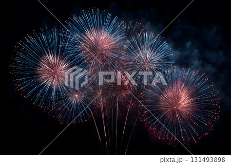 Fireworks display with five fireworks in the foreground 131493898