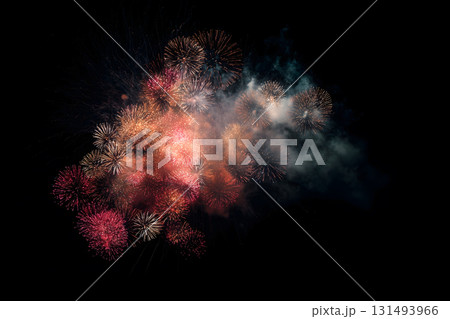 Fireworks display in the night sky with a dark background 131493966