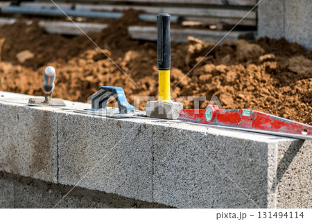 Handyman working on a construction site with tools Handyman working on a construction site with tools 131494114