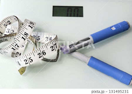 Ozempic Insulin injection pen for diabetics. Concept of losing weight with the drug. Ozempic Insulin injection pen for diabetics. Concept of losing weight with the drug. 131495231