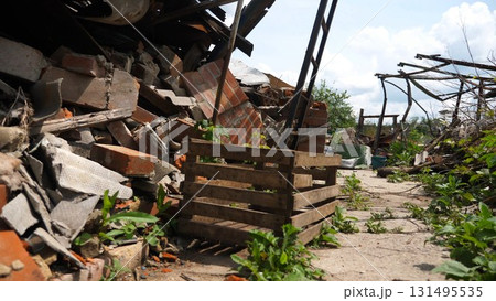 View to destroyed residential buildings at Kharkivska oblast. Ruined houses after bomb attacks on ukrainian territory from russia army. Consequences of russian invasion of Ukraine. Slow motion View to destroyed residential buildings at Kharkivska oblast. Ruined houses after bomb attacks on ukrainian territory from russia army. Consequences of russian invasion of Ukraine. Slow motion 131495535