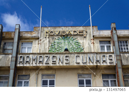 Peacock on facade of art deco building Armazens Cunhas shop designed by architects Manuel Marques, Amoroso Lopes and Coelho Freitas 131497065