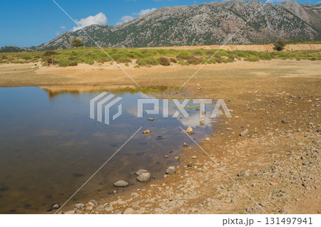 Climate change issue, lake drying in Omalos village in Crete White mountains. Climate change issue, lake drying in Omalos village in Crete White mountains. 131497941