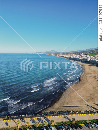 Rethymno city beach in winter aerial drone view. 131497953