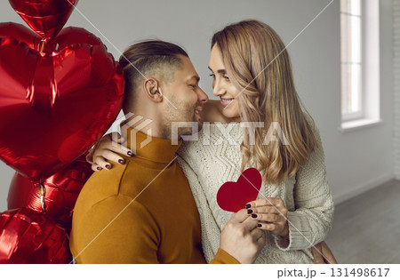 Portrait of happy young couple looking at each other and smiling 131498617