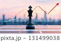 chess or chess piece concept. Strategic chess king with rising graph and cityscape background at sunset symbolizes success 131499038