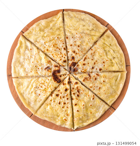 Isolated sliced khychin flatbread on wooden board Isolated sliced khychin flatbread on wooden board 131499054