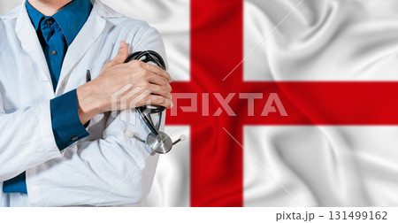 England healthcare concept. Doctor with stethoscope on England flag. Doctor holding stethoscope on English flag 131499162