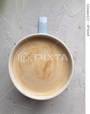 cup of coffee on concrete table, top view cup of coffee on concrete table, top view 131499301