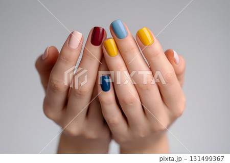 Colorful manicured hands showcase vibrant nail art in a stylish setting highlighting creativity and personality Colorful manicured hands showcase vibrant nail art in a stylish setting highlighting creativity and personality 131499367