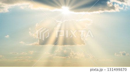 Sun light through cloud on blue sky Sun light through cloud on blue sky 131499870