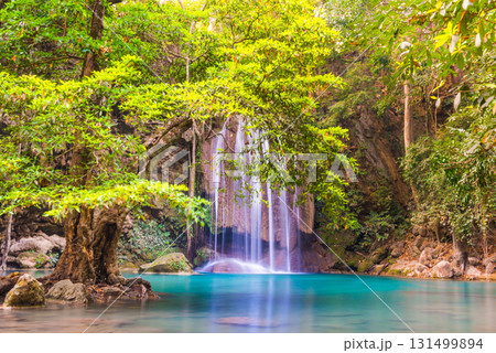 Waterfall in tropical forest with green tree and emerald lake, Erawan, Thailand 131499894
