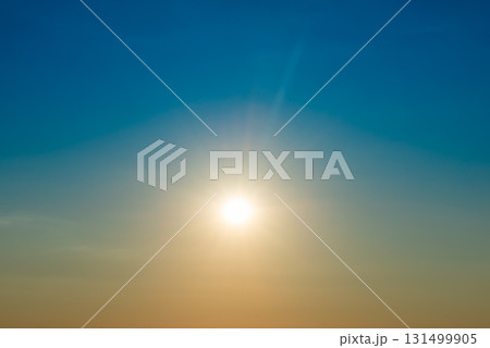 Big shining sun on sunset sky 131499905
