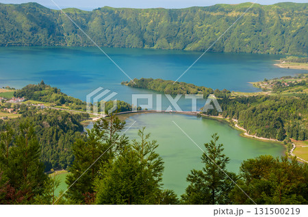 Lagoa das Sete Cidades is located on the island of S. Miguel, Azores and is characterized by the double coloration of its waters, in green and blue Lagoa das Sete Cidades is located on the island of S. Miguel, Azores and is characterized by the double coloration of its waters, in green and blue 131500219
