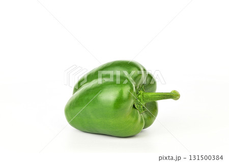 A green pepper is sitting on a white background 131500384
