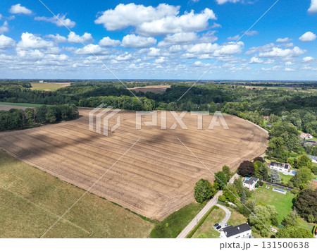 Aerial view of farmland surrounded by forest in the Belgian province of Walloon Brabant. 131500638
