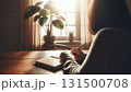 思索・自己成長】窓から光が差し込む机でノートに向かう女性の後ろ姿（縦長） 131500708
