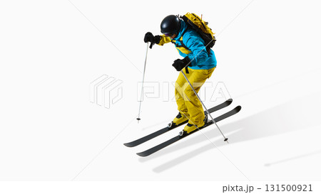 Skier landing from jump in controlled motion isolated on white studio background 131500921