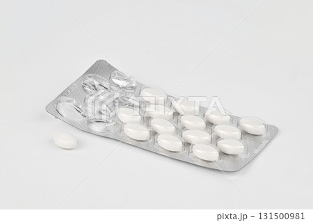 A pack of pills is sitting on a white background 131500981