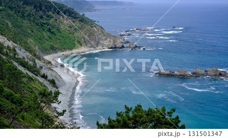 An expansive, elevated landscape os Asturias, Spain, photograph capturing a dramatic, rugged coastline on an overcast day.  131501347