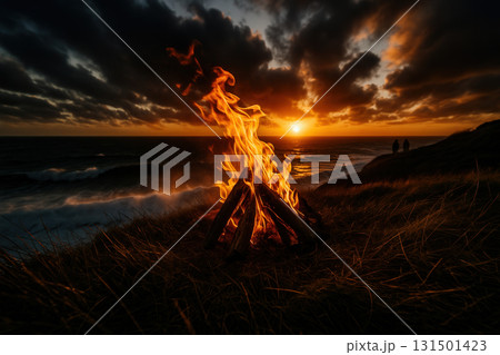Coastal Bonfire Flames Against Stormy Sunset Sky Coastal Bonfire Flames Against Stormy Sunset Sky 131501423