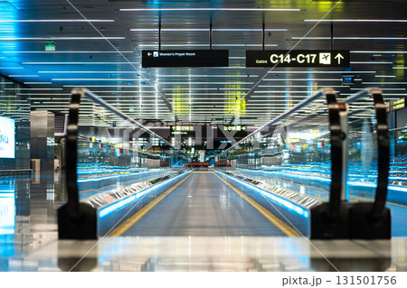 Modern Airport Moving Walkway with Illuminated Glass Railings, Efficient Terminal Conveyor System Featuring Sleek Blue-Lit Design Modern Airport Moving Walkway with Illuminated Glass Railings, Efficient Terminal Conveyor System Featuring Sleek Blue-Lit Design 131501756