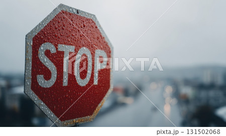 Stop Sign Covered In Raindrops On A Rainy Day. Symbol Of Caution And Safety In Wet Weather Conditions Stop Sign Covered In Raindrops On A Rainy Day. Symbol Of Caution And Safety In Wet Weather Conditions 131502068