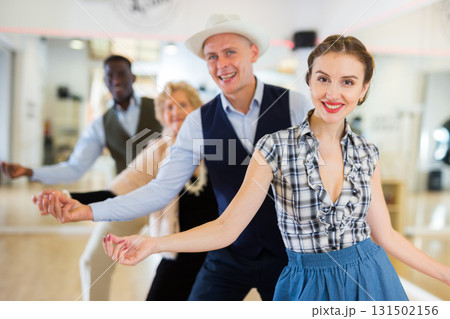 Group of different age dancers preparing swing performance 131502156