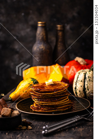 Pumpkin pancakes with maple syrup Pumpkin pancakes with maple syrup 131504034
