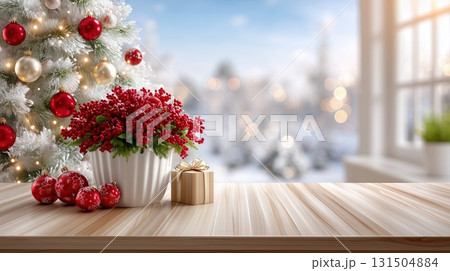 Christmas table with festive decorations, snow-covered tree, and winter window view 131504884