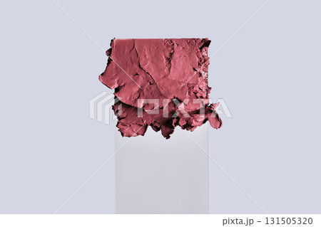 The texture of red lipstick on glass on a neutral background. The texture of red lipstick on glass on a neutral background. 131505320