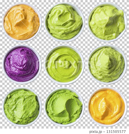 vibrant assortment of colorful sauces in small white bowls, featuring shades of green, yellow, and purple, arranged in grid pattern. creamy textures and bright colors create appetizing display 131505577
