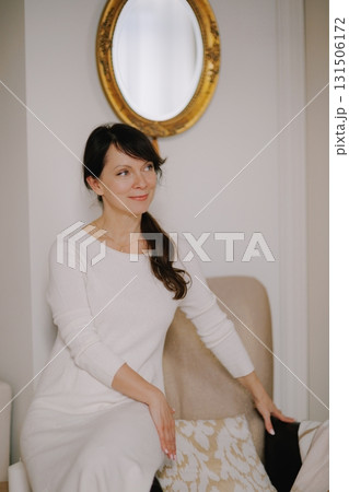 Mature woman smiling, looking away, reflecting, elegant portrait 131506172