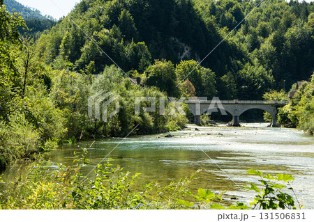 Beautiful Mountain Landscape in the Alps with Bridge over Clear River 131506831