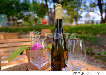 wine glasses on a wooden table 131507239