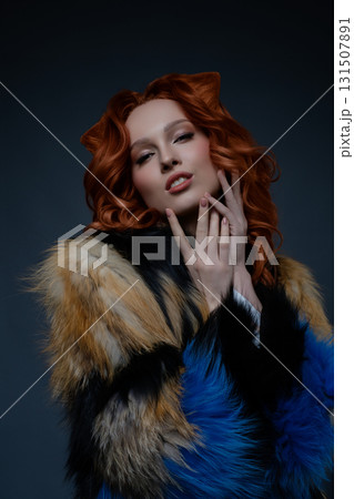 Beauty woman showcases unique body art with fur in a studio setting Beauty woman showcases unique body art with fur in a studio setting 131507891