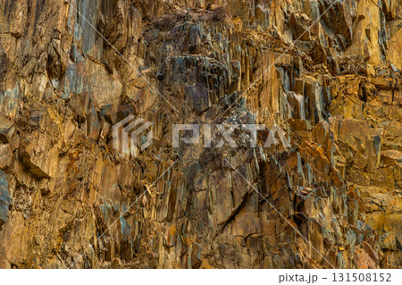 Rugged rock formation in mountainous outdoor setting 131508152