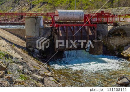 Water control structure releasing water in mountainous region 131508153