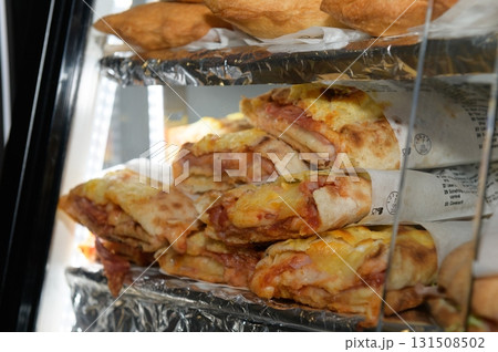 Apulian Savory flatbread Puccia Displayed in a Food Stand Apulian Savory flatbread Puccia Displayed in a Food Stand 131508502