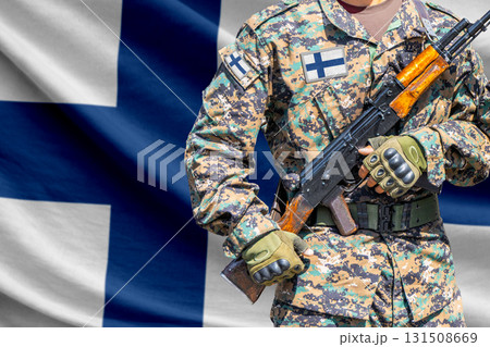 Finland flag with soldier holding assault rifle Finland flag with soldier holding assault rifle 131508669