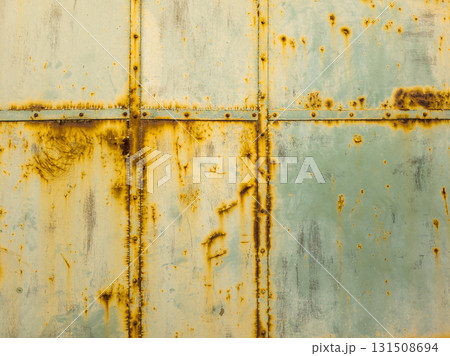 Rusty steel surface with screws and seams 131508694