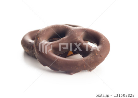 Chocolate covered pretzels isolated on white background. Chocolate covered pretzels isolated on white background. 131508828