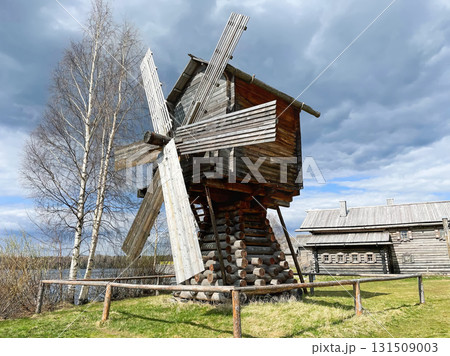 Ancient Wooden Mill near Birch Trees under Cloudy Sky 131509003