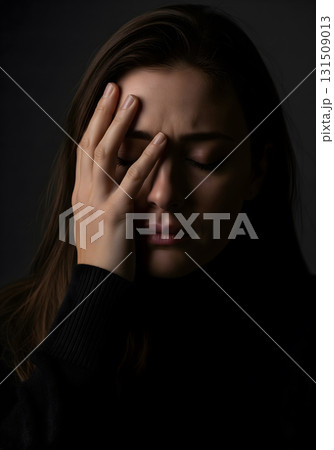 Upset Woman with Hand on Her Face 131509013