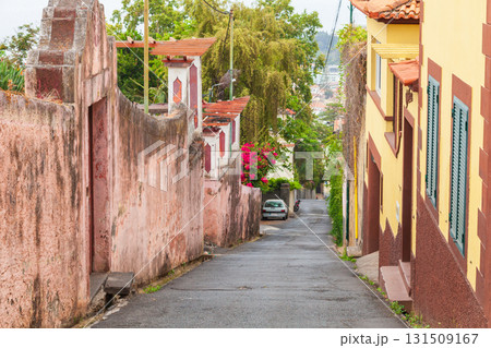 Funchal, Madeira, Portugal. Vibrant street scene with a narrow empty alley 131509167