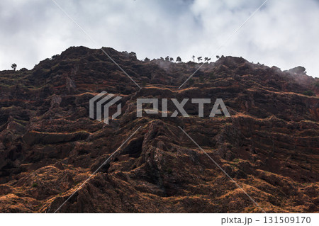 Madeira, Portugal. Rugged cliff and layered rock formations Madeira, Portugal. Rugged cliff and layered rock formations 131509170