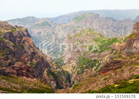 A dramatic canyon carved by steep cliffs and layered rock. Landscape of Madeira A dramatic canyon carved by steep cliffs and layered rock. Landscape of Madeira 131509178