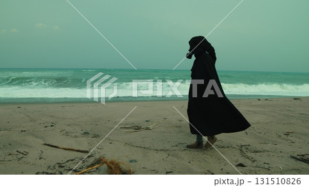 A Man In A Cloak And Gas Mask Walks On A Radiation Poisoned Beach A Man In A Cloak And Gas Mask Walks On A Radiation Poisoned Beach 131510826